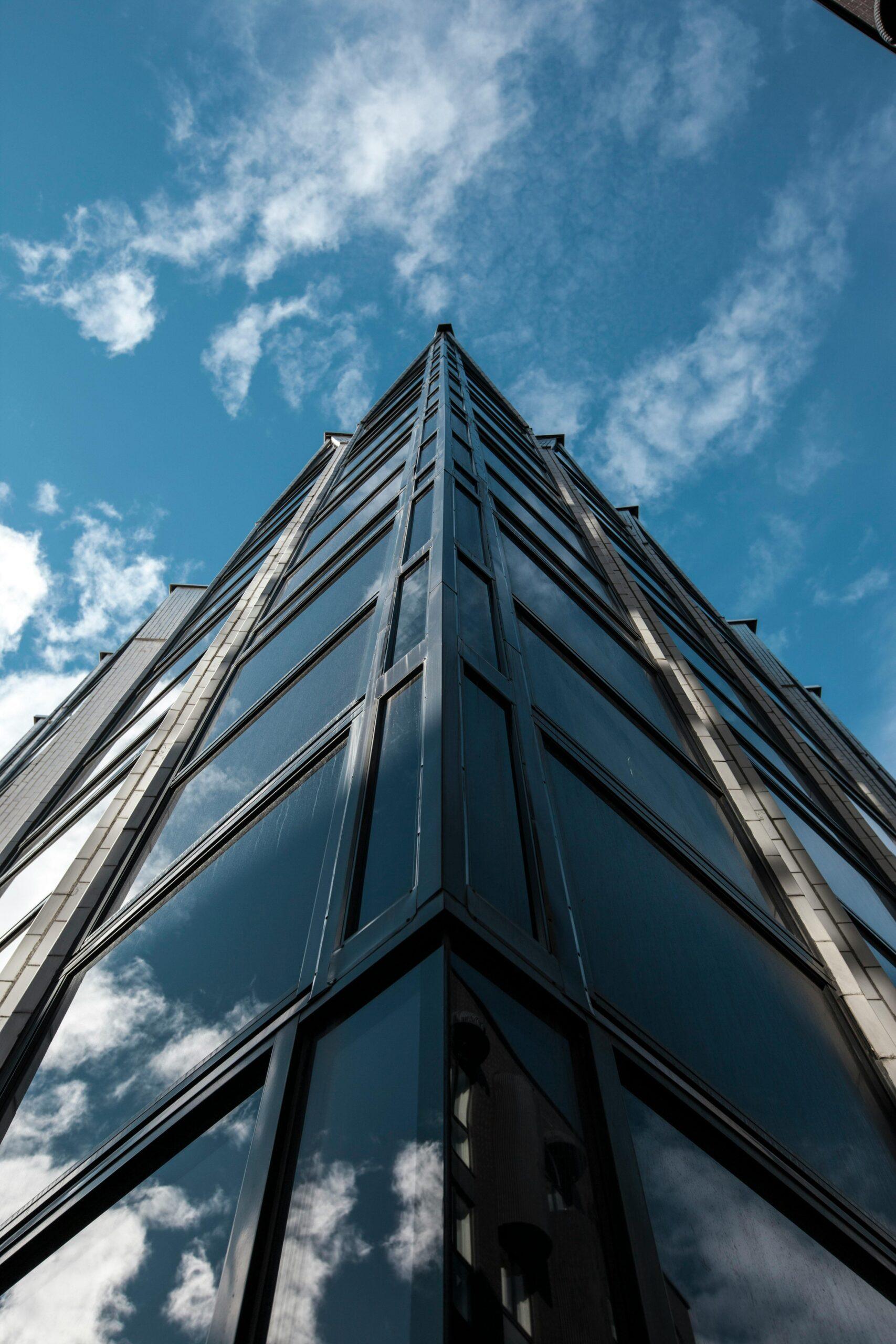 A modern glass skyscraper reflecting the sky in Kesklinna, Estonia.